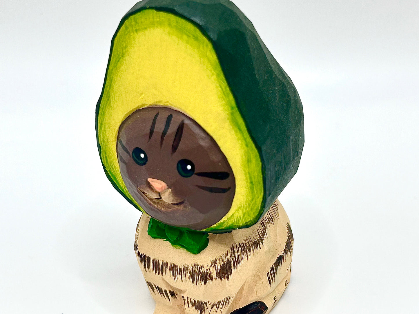 Whimsical Wood Doorstop: Playful Cat with Avocado Hat Accent